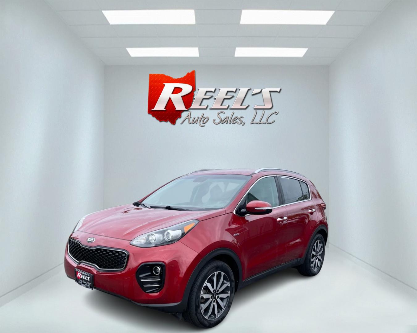 2018 Red /Gray Kia Sportage EX AWD (KNDPNCAC3J7) with an 2.4L I4 DOHC 24V engine, 6A transmission, located at 547 E. Main St., Orwell, OH, 44076, (440) 437-5893, 41.535435, -80.847855 - This 2018 Kia Sportage EX AWD is a well-rounded compact SUV that offers a good blend of capability and features. It comes equipped with a 2.4L I4 GDI engine paired with a 6-speed automatic transmission and AWD system with locking center differential. The driving experience is enhanced by features li - Photo#0